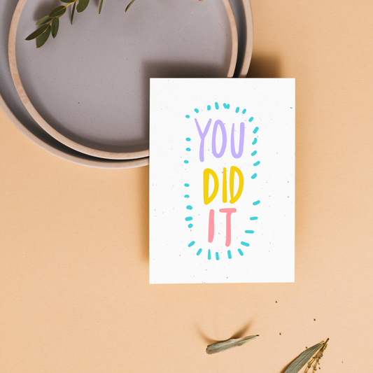 Motivational card with 'YOU DID IT' text on a beige background
