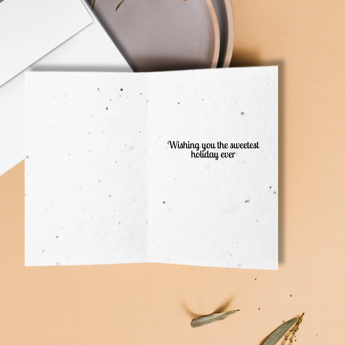 White card with text 'Wishing you the sweetest holiday ever' inside
