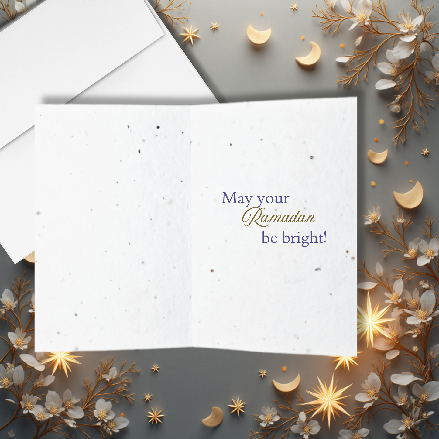Greeting card with 'May your Ramadan be bright!' text inside, surrounded by decorative elements on a gray background.