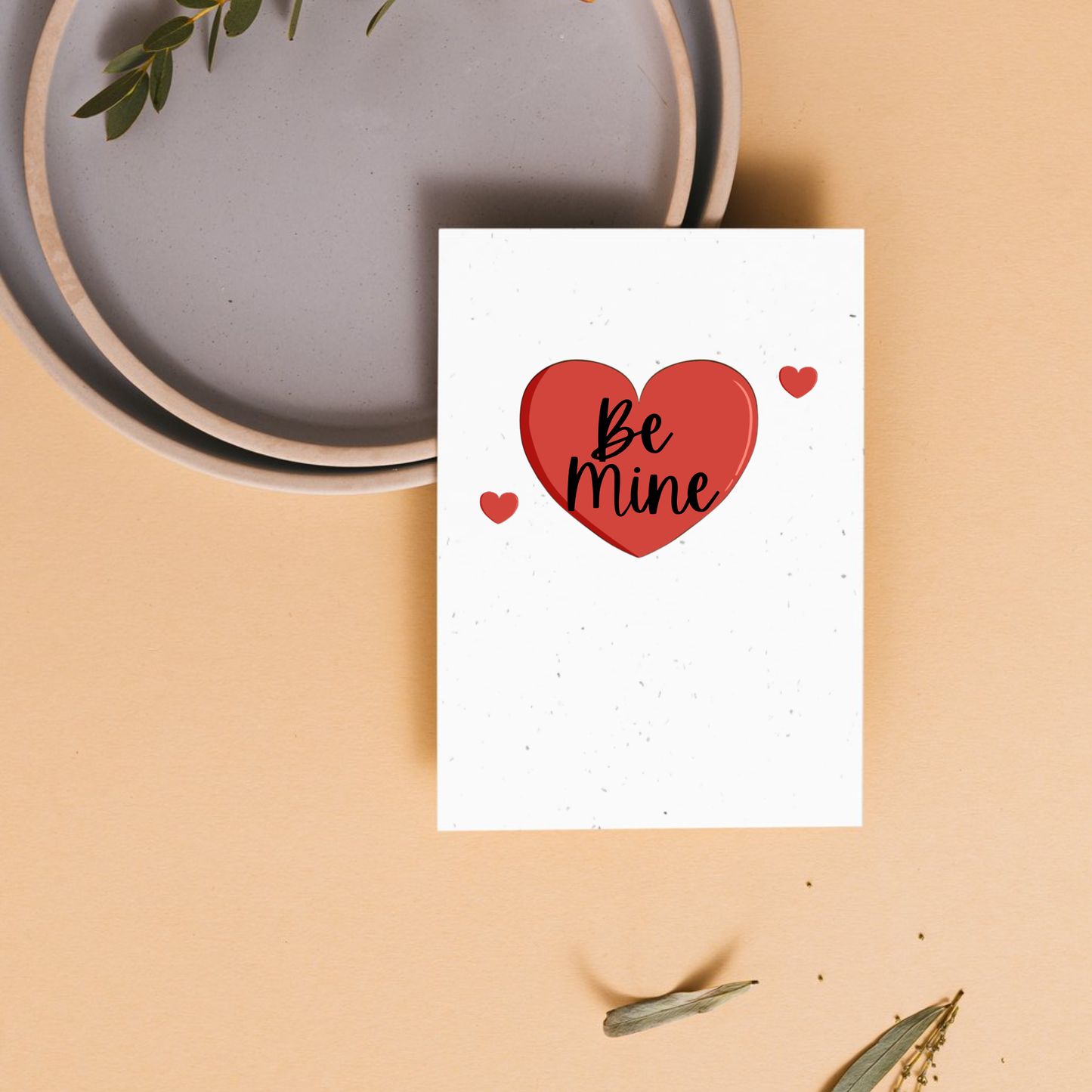 Card with a red heart and 'Be Mine' text inside the heart