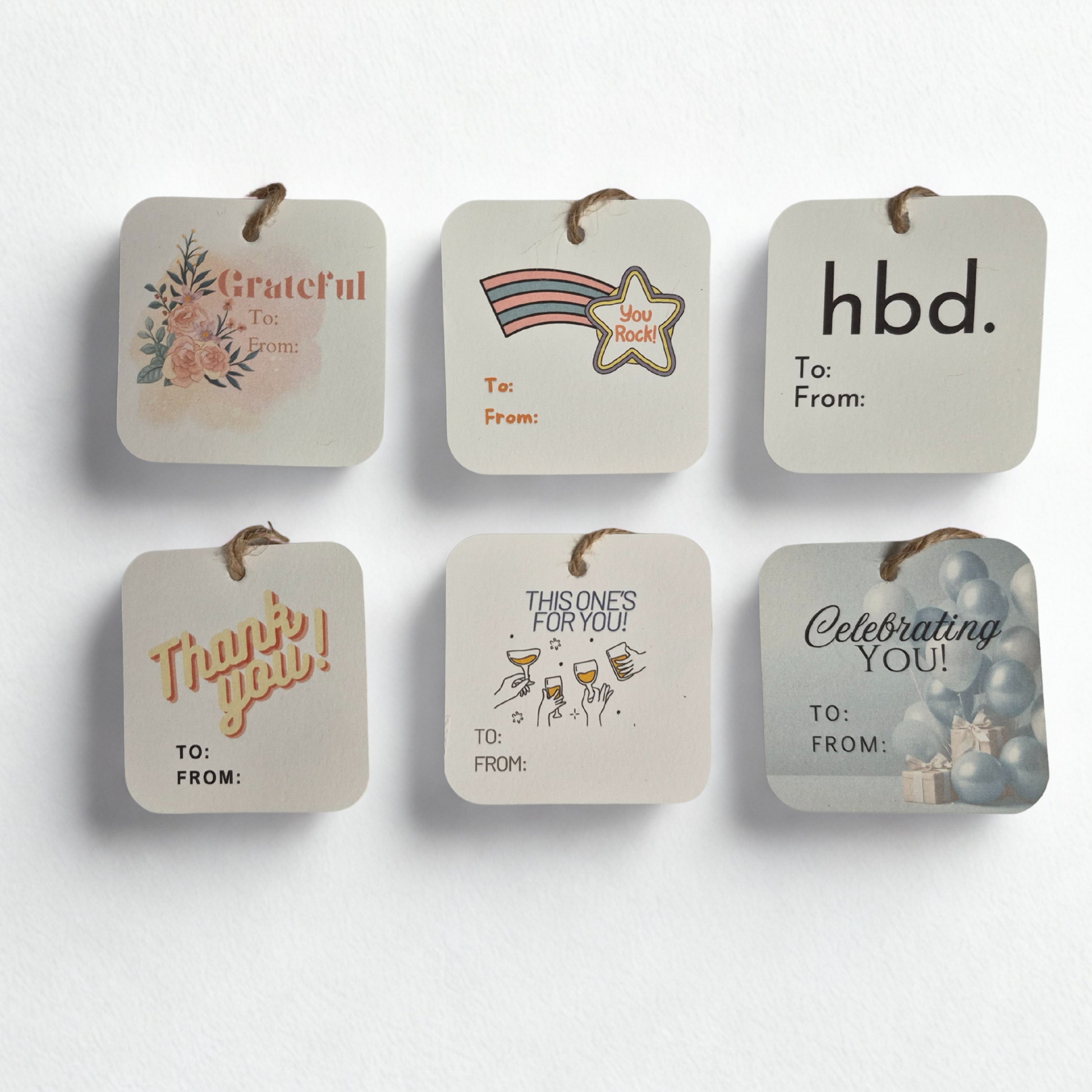 Set of six square gift tags with different messages and designs on a white background