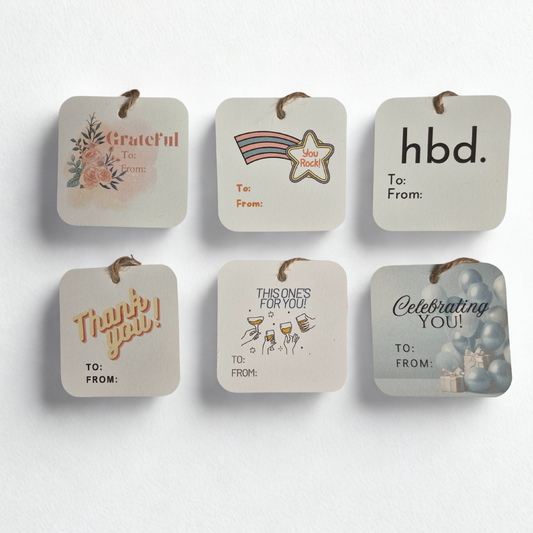 Set of six square gift tags with different messages and designs on a white background