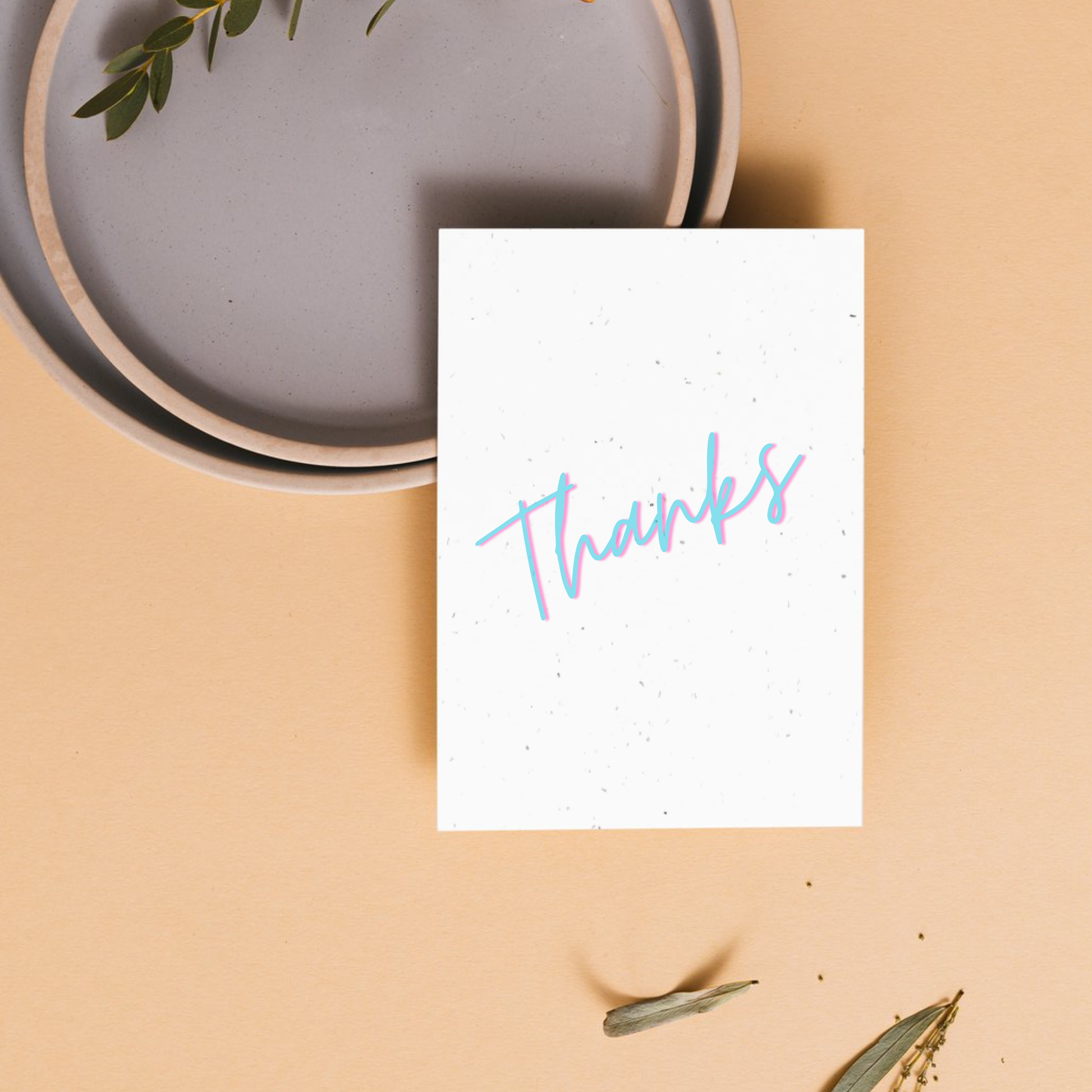 White card with 'Thanks' written on it