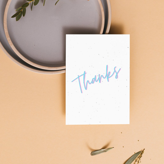 White card with 'Thanks' written on it