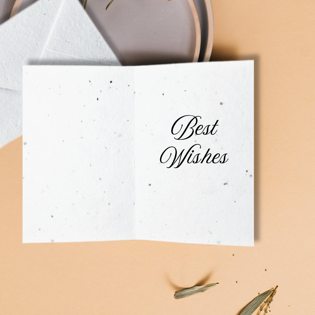 White card with 'Best Wishes' text on a beige surface