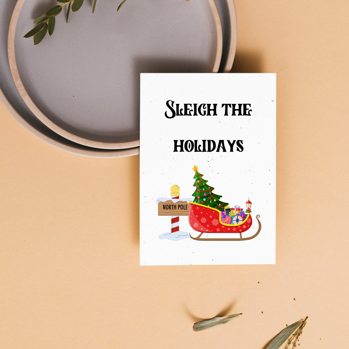 Holiday card with 'Sleigh the Holidays' text and sleigh filled with presents and a tree