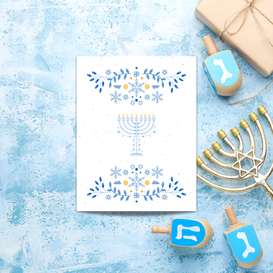 Card with Menorah design surrounded by Hanukkah-themed items 