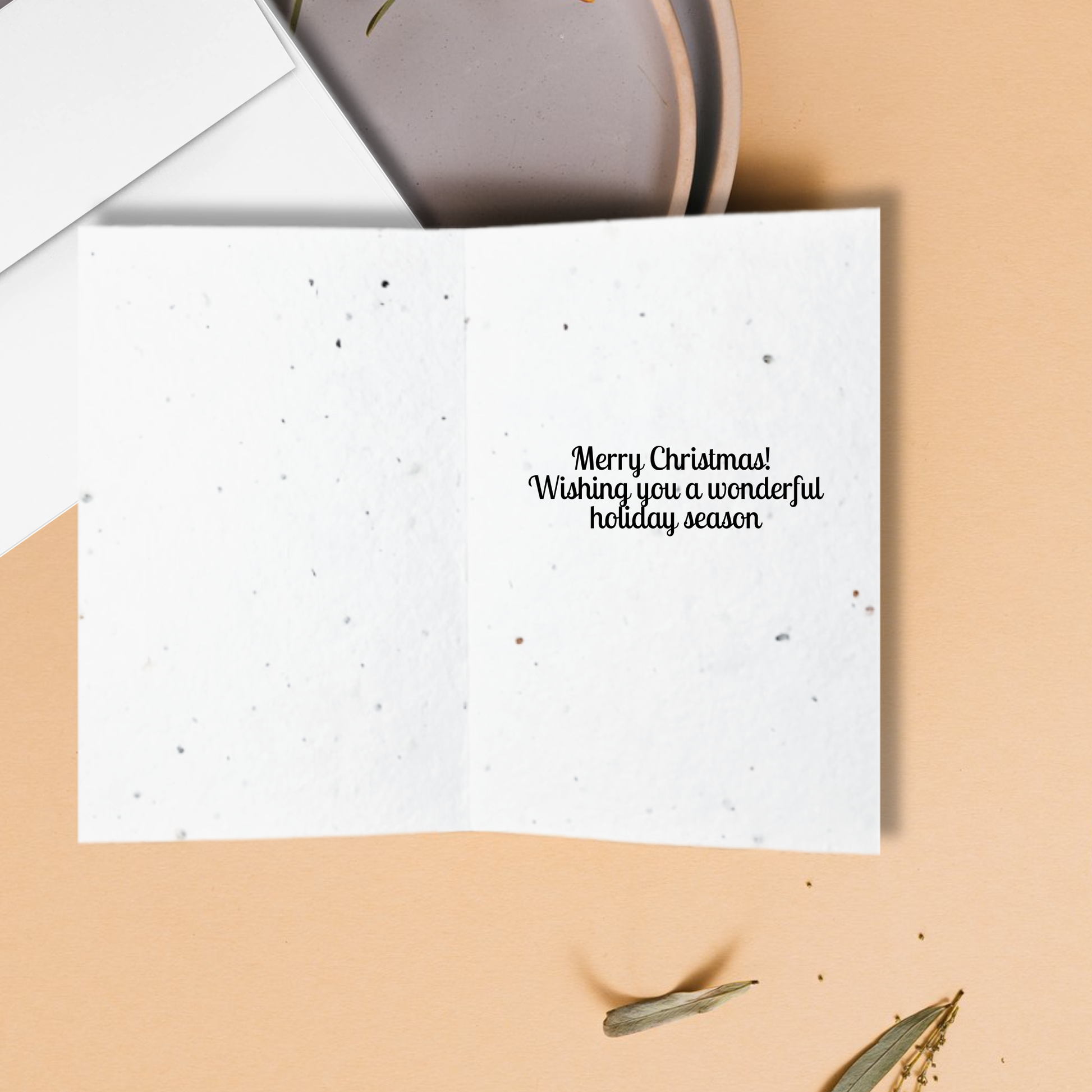 White card with Christmas message 'Merry Christmas! Wishing you a wonderful holiday season'