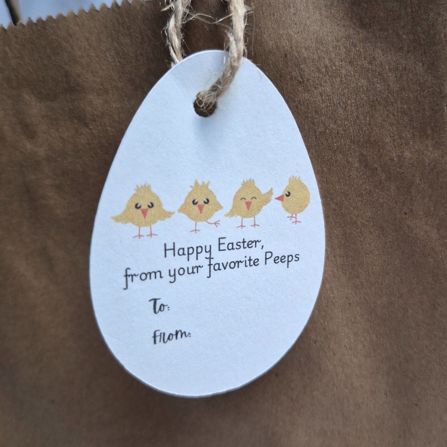 Easter egg-shaped tag with chicks 