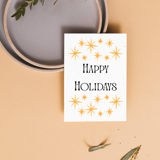Christmas plantable greeting card with 'Happy Holidays' text and star designs 
