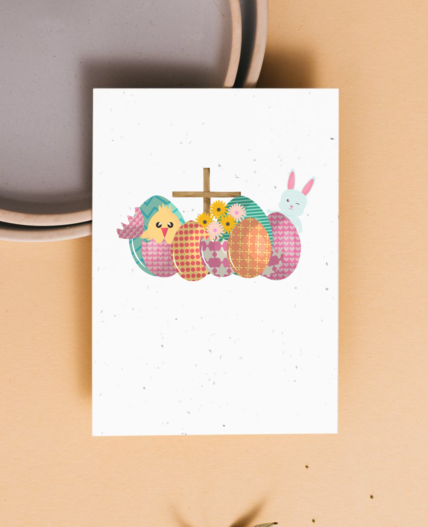 Greeting card with Easter-themed illustrations of bunnies, a cross and Easter eggs on a beige background