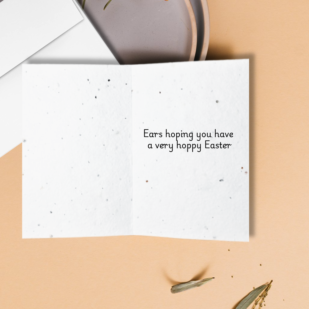 Inside an Easter greeting card with 'Ears hoping you have a very hoppy Easter' text on a textured background