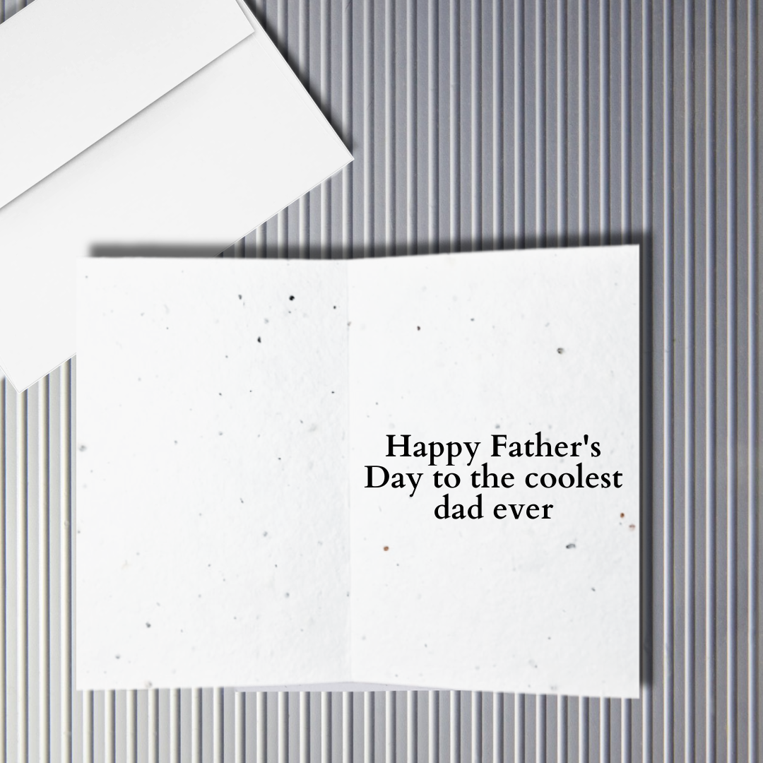 Inside a Father's Day greeting card with 'Happy Father's Day to the coolest dad ever' text on a textured white background.