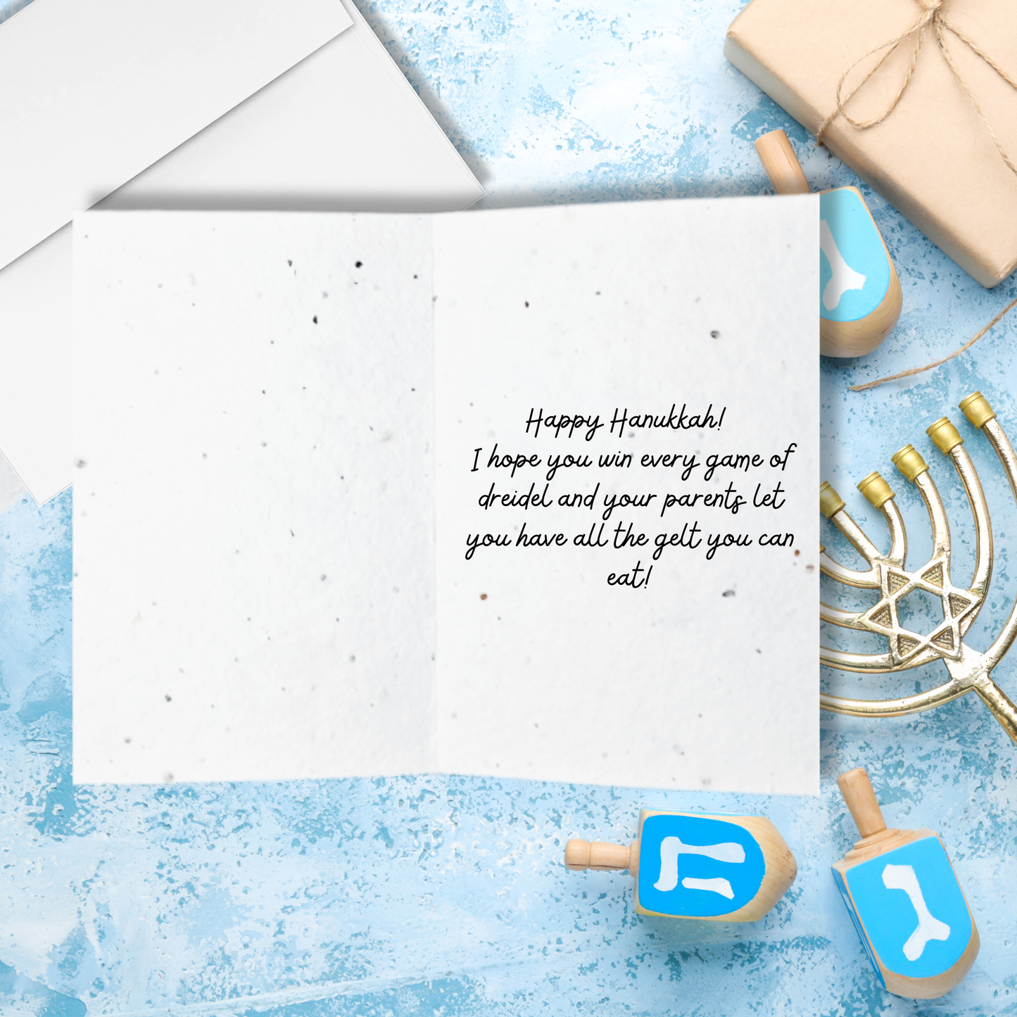 Inside Hanukkah card with black text 'happy Hanukkah! I hope you win every game of dreidel and your parents let you have all the gelt you can eat'