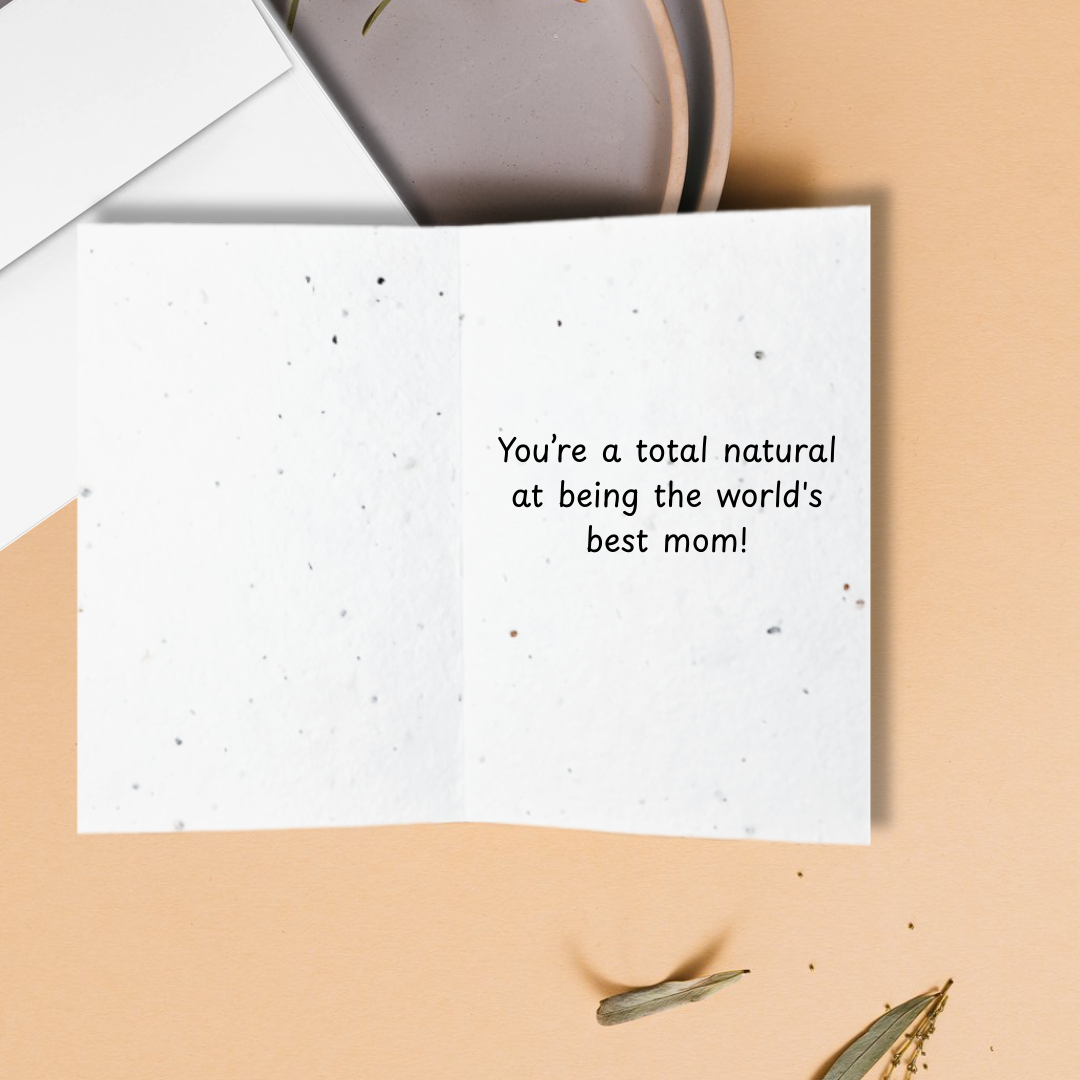 Inside Mother's day Greeting card with text 'You're a total natural at being the world's best mom!' on a beige background.