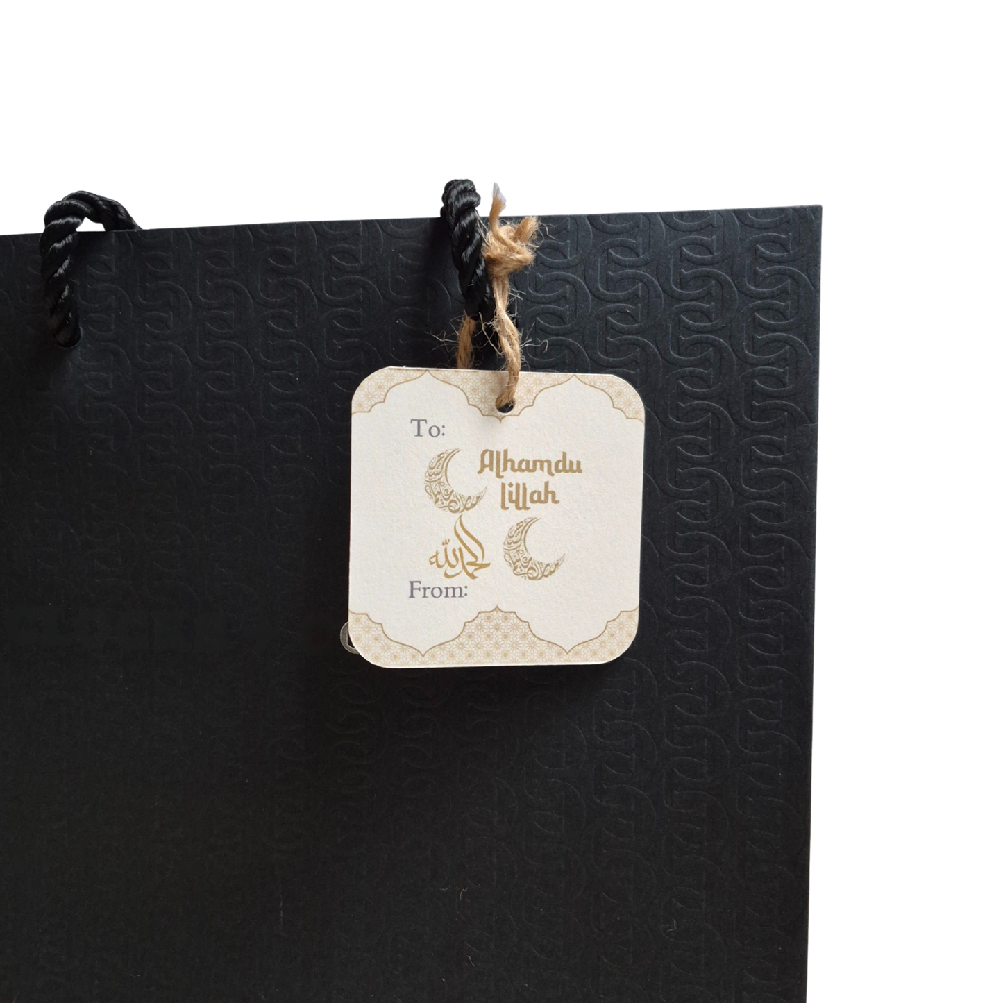 Black gift bag with 'Alhamdulillah' decorative text on a recycled paper gift tag that is eco-friendly