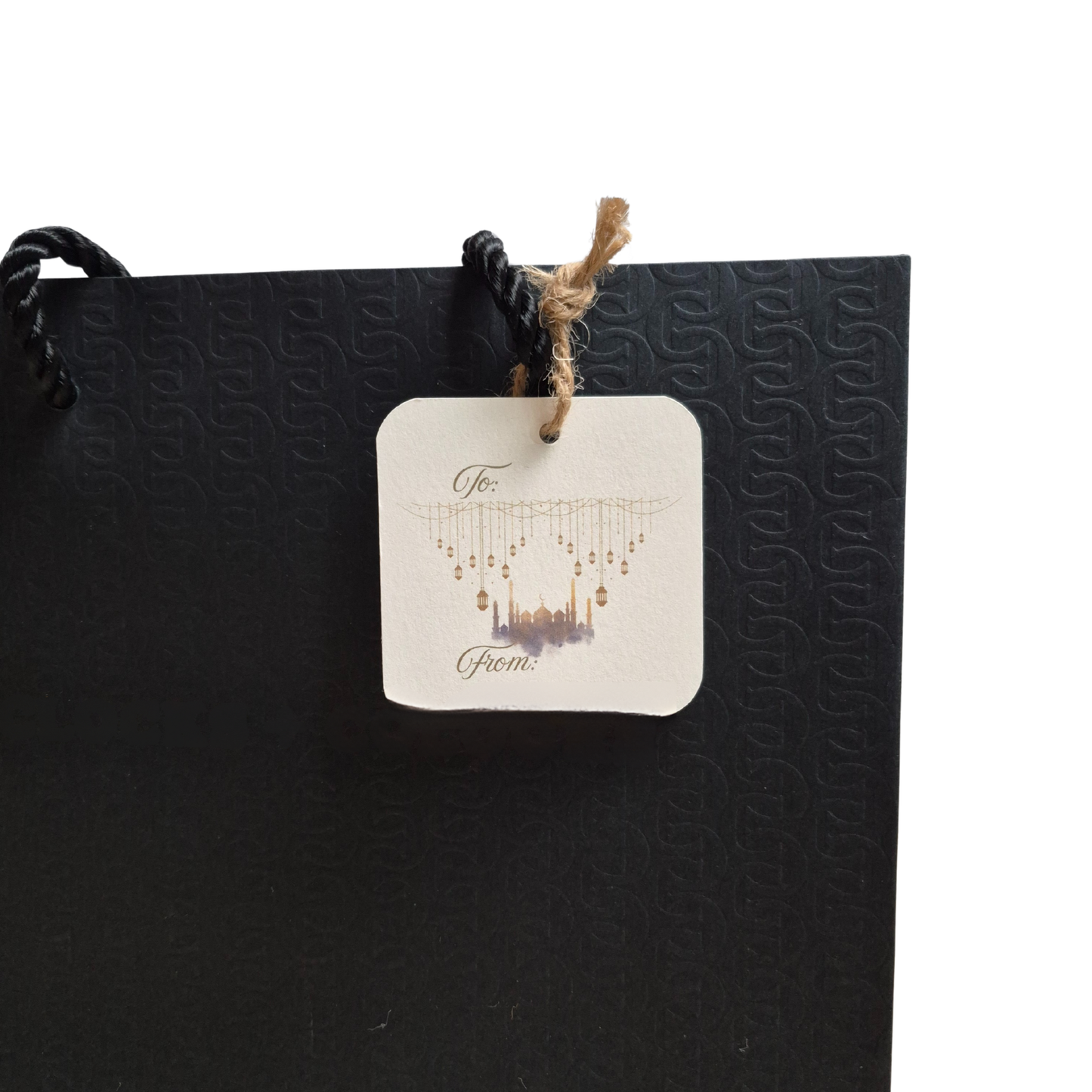 Black gift bag with mosque and lanterns on a recycled paper gift tag that is eco-friendly