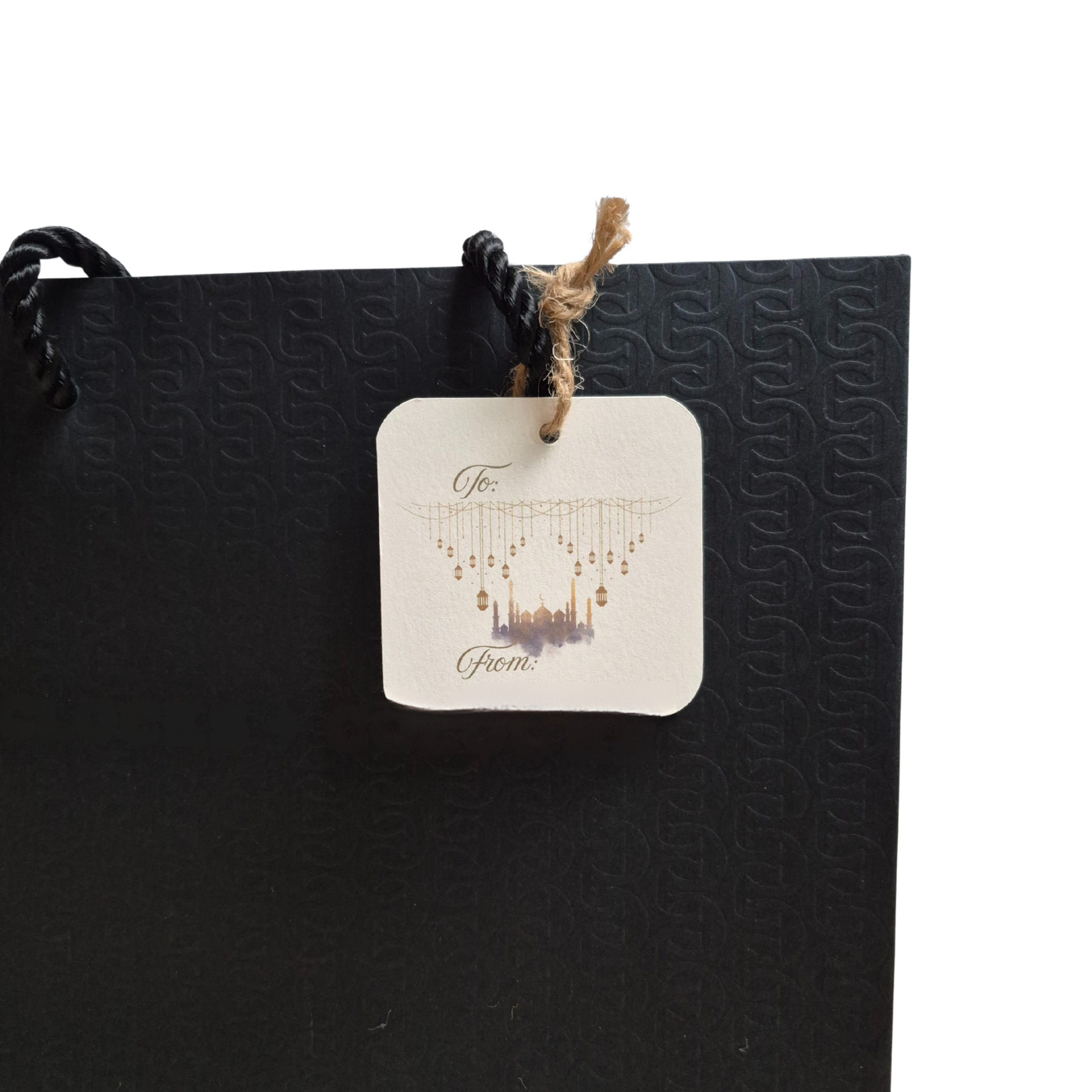 Black gift bag with mosque and lanterns on a recycled paper gift tag that is eco-friendly