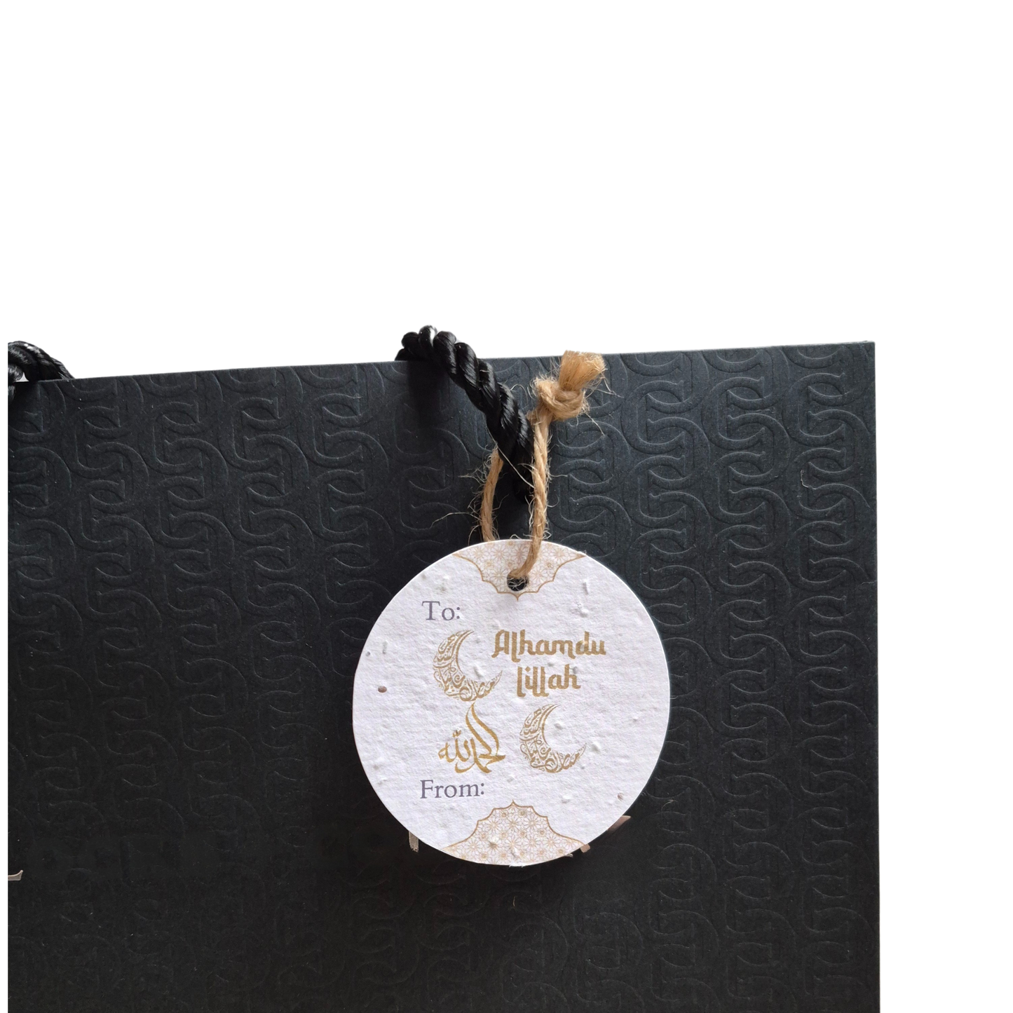 Black gift bag with 'Alhamdulillah' decorative text on a seed paper gift tag that is eco-friendly