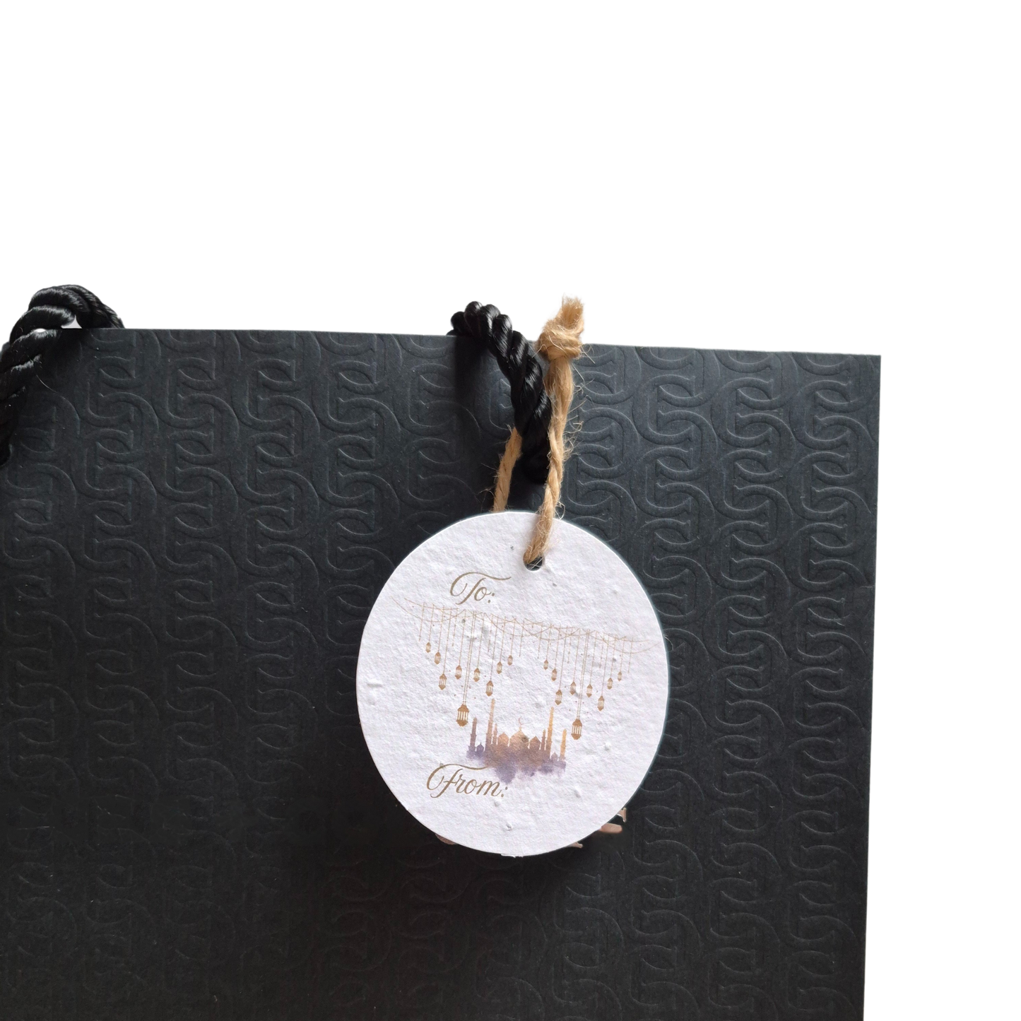 Black gift bag with mosque and lanterns on a seed paper paper gift tag that is eco-friendly
