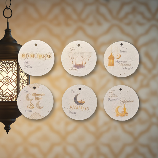 Decorative tags with Ramadan greetings on a textured beige background with a hanging lantern.