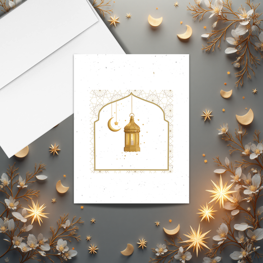 Ramadan seed paper card with gold lantern design surrounded by floral and celestial elements on a gray background.