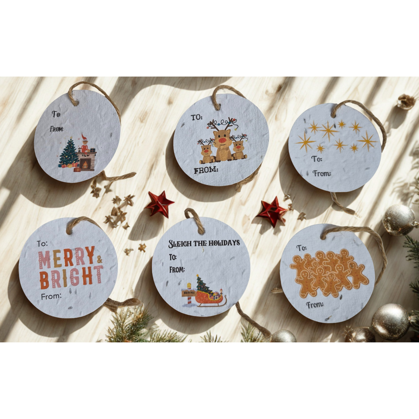 Set of round Christmas-themed gift tags made of seed paper, placed on a wooden surface with decorative elements.
