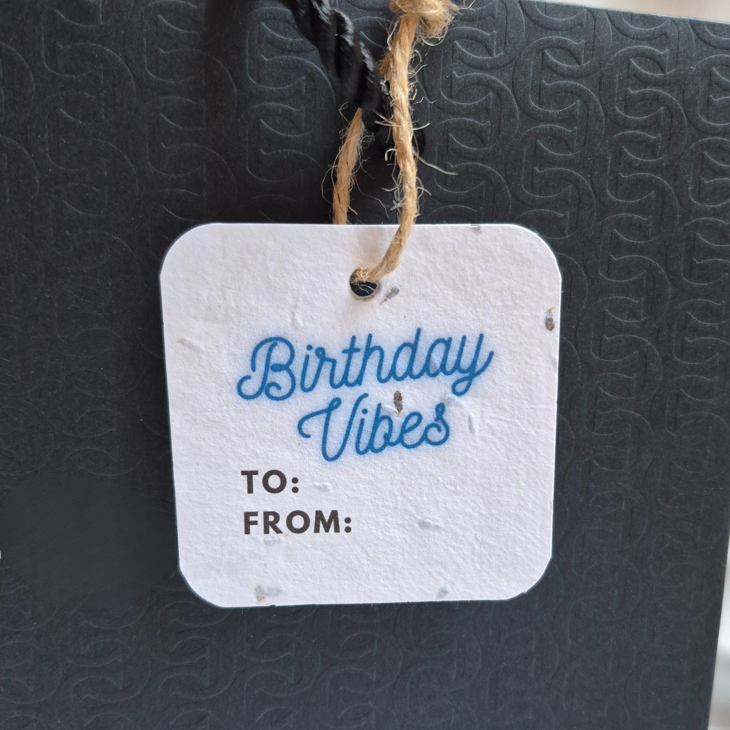 Square Birthday gift tag with 'Birthday Vibes' in blue neon text on a textured black surface