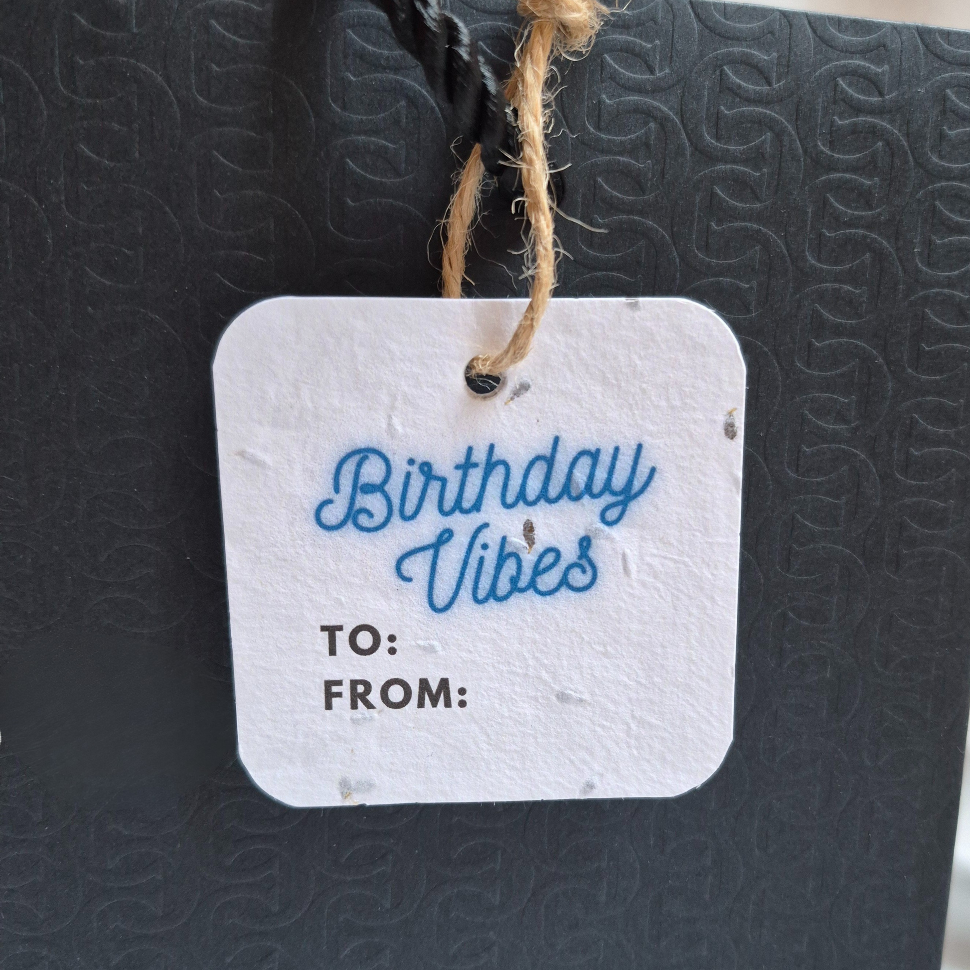 Square Birthday gift tag with 'Birthday Vibes' in blue neon text on a textured black surface