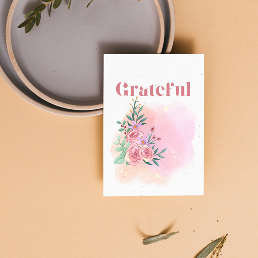 Thank you card with floral design and 'Grateful' text on a beige background