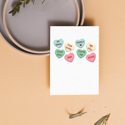 Valentine's day card with colorful sweet heart candy illustrations on a beige background